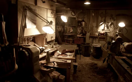 A small trade workshop with benches and stored materials