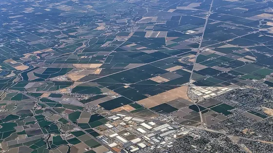 Tracy seen from the air with farmland running to the edge of town