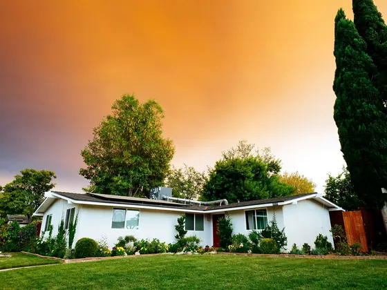 A single story California ranch house at dusk