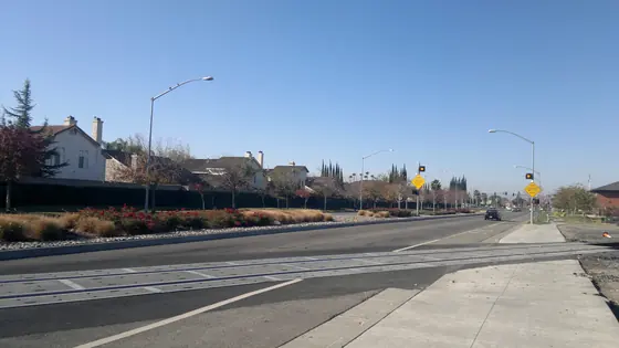 A wide residential street on the edge of Tracy