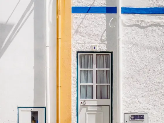A service riser and meter set on the side of a house
