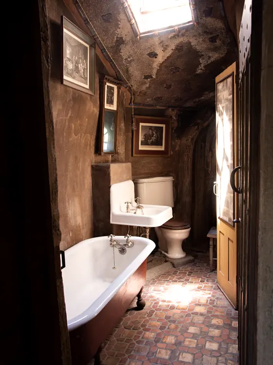 A claw foot tub in an older home bathroom
