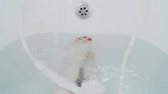 A bath filling from a wall mounted spout