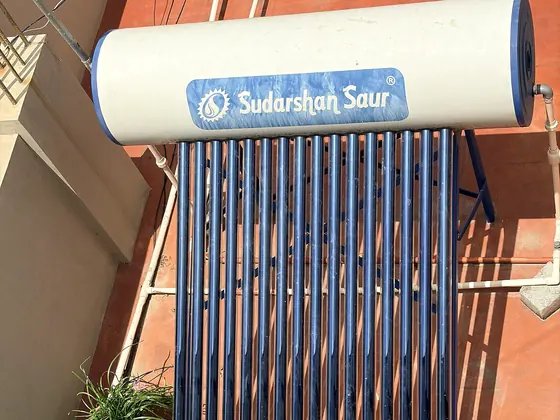 A solar assisted water heater mounted on a rooftop